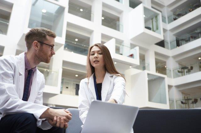 Doctor consulting with a nurse