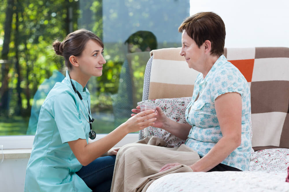 A nurse working with a patient in an underserved area