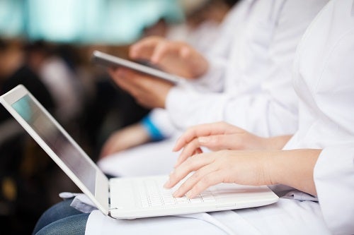 nurse working on laptop