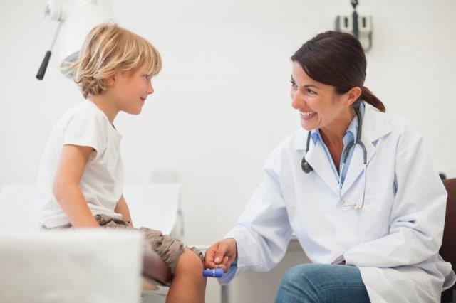 Nurse smiling at child patient