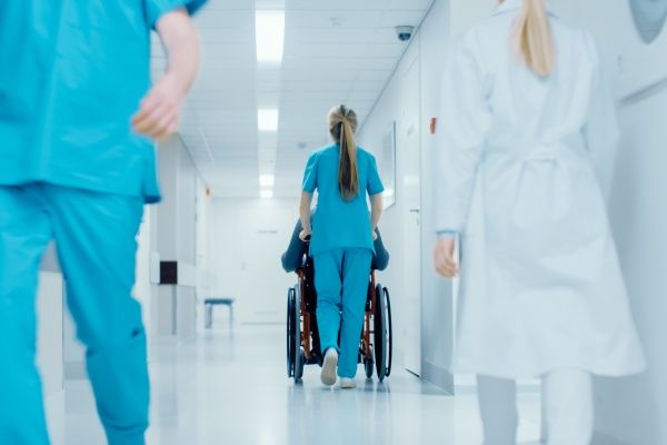 Health care workers and nurses going about their day in a hospital