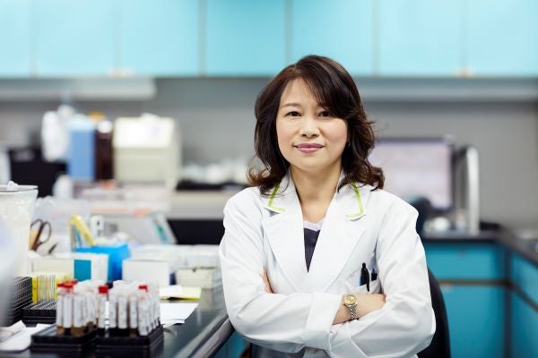 Female Asian-American nurse practitioner in lab setting